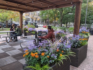 Graduate student, Muhammad Rochman, uses multiple devices to test performance of local Wi-Fi networks and LAA.