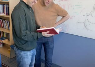two people reading a book