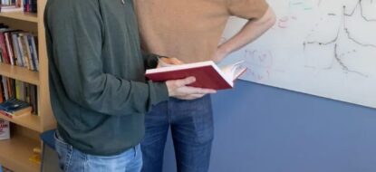 two people reading a book